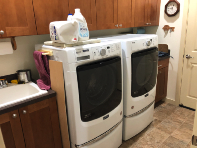 Laundry Room has deep cabinets and
newer Maytag hi-capacity washer/dryer